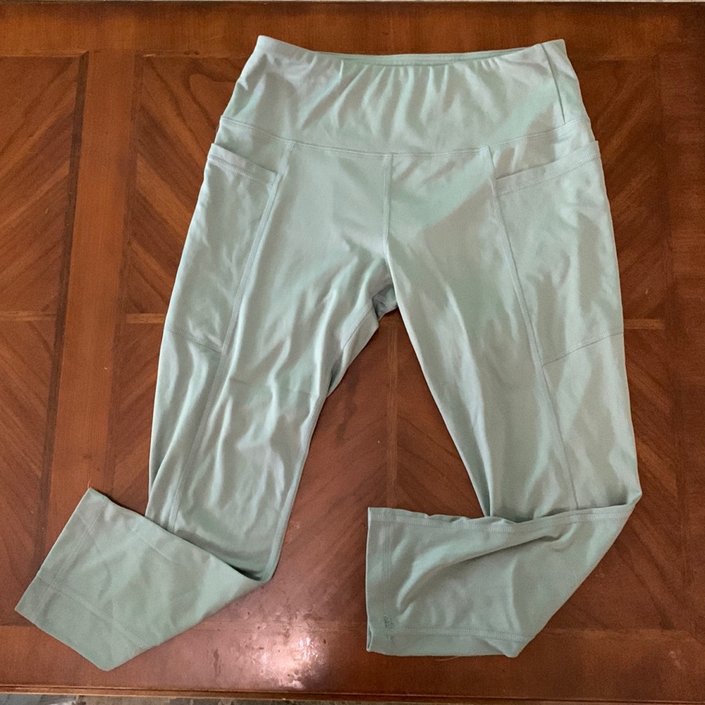 Jade green athletic leggings with pockets